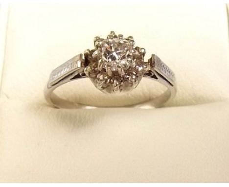 An 18ct white gold diamond cluster ring 