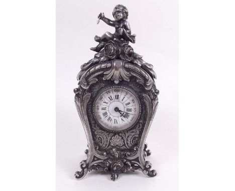 A 19th century French silver plated miniature mantel or boudoir clock by Le Roy Fils, the bombe form case with all over cast 