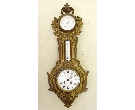 A Victorian Coalbrookdale gilt eight day clock with dual scale thermometer and a barometer, with foliage decoration