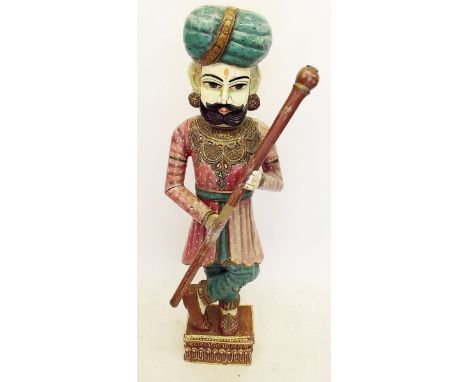 A large carved wood polychrome figure of Indian guardsman (stick a/f) - 1.2m