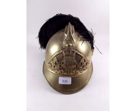 A 19th century French gilt brass helmet with feather