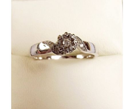 A 9ct white gold ring illusion set diamond 