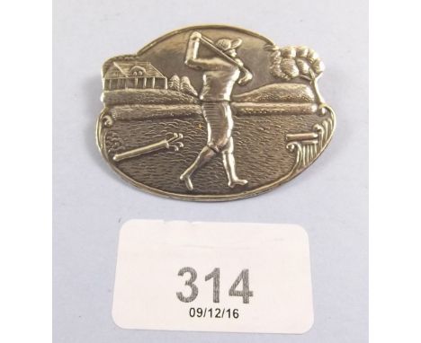 A sterling silver Art Deco golf brooch