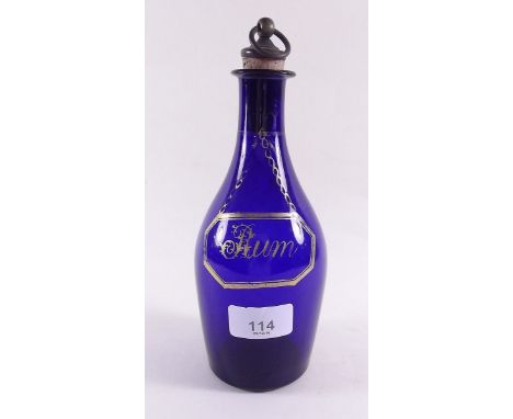 A Bristol blue early 19th century decanter with gilt 'Rum' label, chip to back of rim