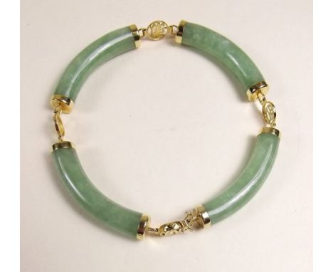 A 14ct gold and jade Chinese bracelet 