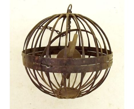 An early 19th century ships Whalers lamp in iron caged gimball surround 