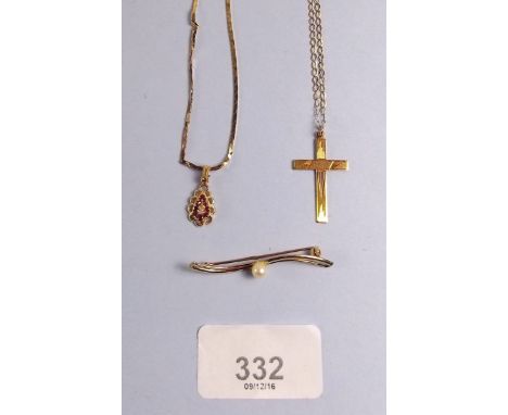 A 9ct gold crucifix, a gold brooch set pearl and a gold pendant necklace (Ratners)