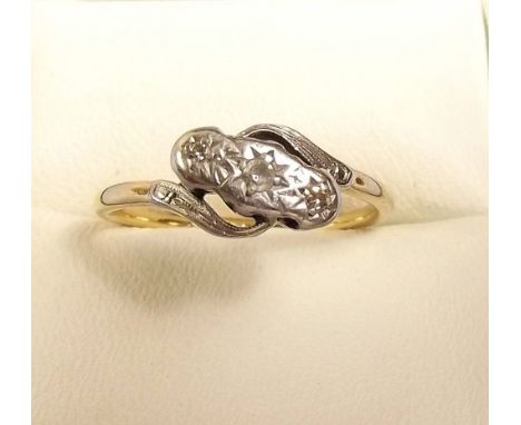 A 9ct gold and platinum three stone crossover illusion set diamond ring 