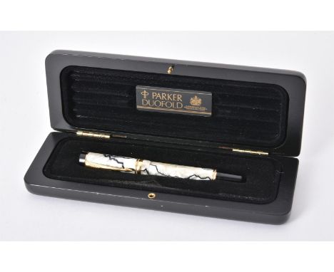 
	
		Parker, Duofold, a white and black marbled fountain pen, with cartridge converter, the nib stamped Parker 18k 750, inked