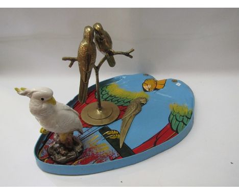 A brass figure of a pair of cockatoos, brass cockatoo paper knife, a painted tray in the form of cockatoos and a ceramic cock