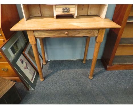 A light oak side table with frieze fall flap revealing sectional interior together with a pine mirrored gallery back dressing