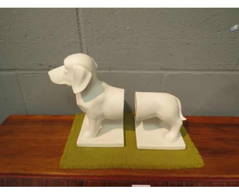 A pair of ceramic boookends in the form of a dog