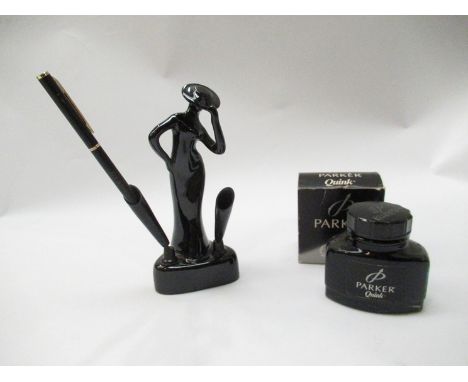An Art Deco style ceramic lady pen holder, 16cm tall, together with a Parker Quink bottle