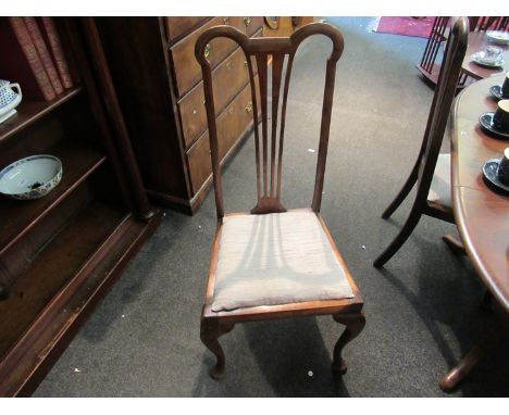 A set of four Chippendale style chairs with oatmeal colour upholstered seats