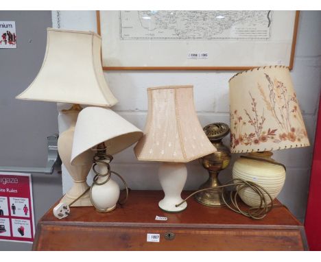 A brass oil lamp and four other lamps and shades  (5)