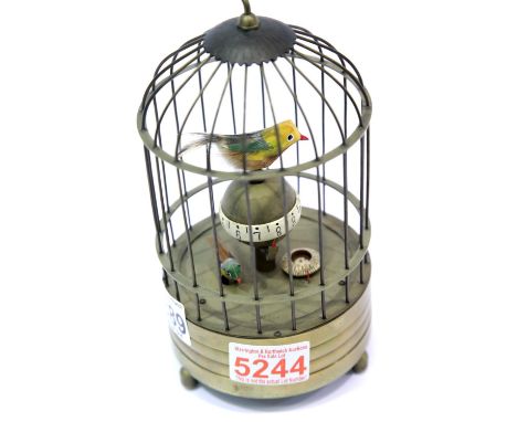 Brass automaton tweeting bird clock in working order, H: 22 cm. P&amp;P Group 1 (£14+VAT for the first lot and £1+VAT for sub