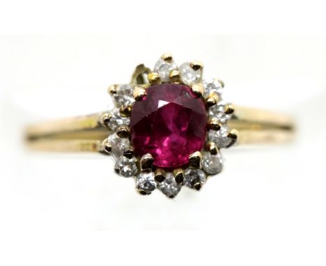 14ct gold dress ring with central ruby and diamond surround, one diamond missing but present in the box with valuation and re