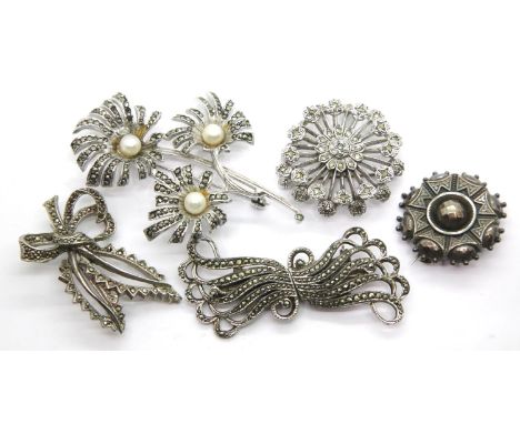 Four vintage white metal marcasite set brooches and a further white metal brooch. P&amp;P Group 1 (£14+VAT for the first lot 