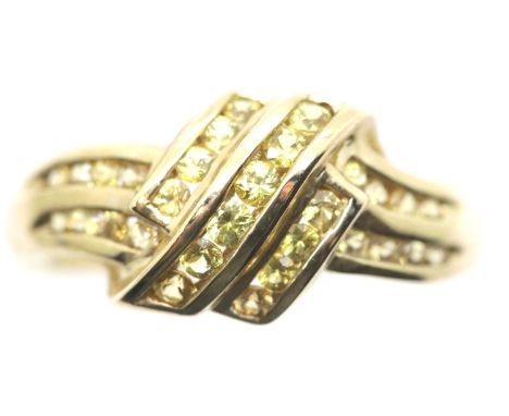 9ct gold ring channel set with yellow stones, size P, 2.9g. P&amp;P Group 1 (£14+VAT for the first lot and £1+VAT for subsequ
