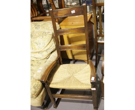 19thC rush seat ladder back rocking armchair. Not available for in-house P&amp;P. 