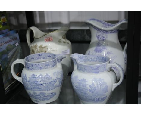 Mintons Oldham design water pitcher, H: 26 cm, together with three blue over white decorated 19th century jugs. Not available