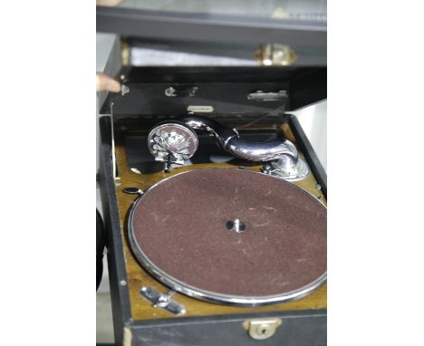 Portable record player and a selection of records. This lot is not available for in-house P&amp;P. 