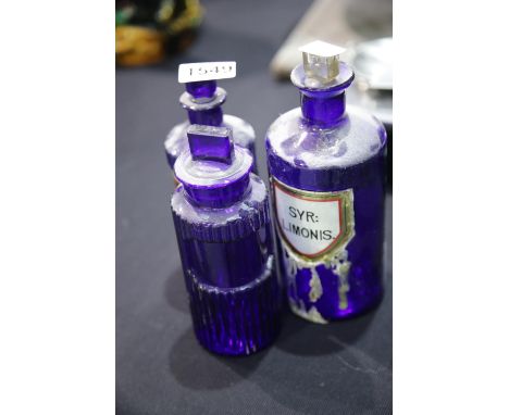 Three vintage blue ribbed pharmacy poison bottles, tallest H: 22 cm. P&amp;P Group 2 (£18+VAT for the first lot and £3+VAT fo