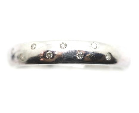 9ct white gold band set with small diamonds, size R, 2.5g. P&amp;P Group 1 (£14+VAT for the first lot and £1+VAT for subseque