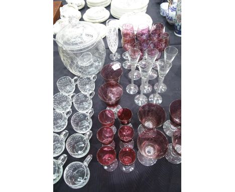 Glassware, to include a cut glass covered punch bowl with ladle and ten cups, two sets of etched cranberry wine goblets and a