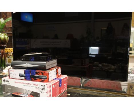 Home cinema system, comprising a Panasonic 65" television, boxed Bose CineMate speaker system, two boxed DVD &amp; Blu-ray pl
