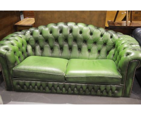 20thC Chesterfield style two-seater sofa, in green leather, L: 195 cm. This lot is not available for in-house P&amp;P 