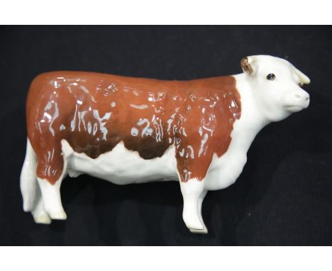 Beswick glazed ceramic Hereford cow marked CH of Champions, L: 17 cm. P&amp;P Group 1 (£14+VAT for the first lot and £1+VAT f