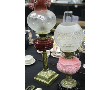 19th century brass and glass columnular oil lamp with bi-coloured etched globe shade and clear chimney,H: 66 cm, and another 