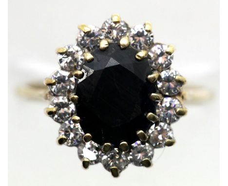 9ct gold sapphire and CZ set oval cluster ring, size O/P, 3.3g. P&amp;P Group 1 (£14+VAT for the first lot and £1+VAT for sub