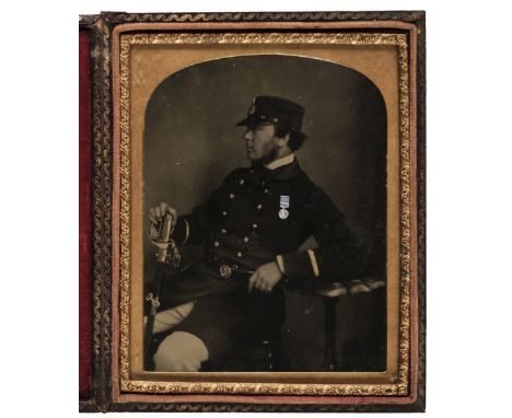 * Ambrotype. Half-plate ambrotype of a naval officer in profile holding his sword and wearing a medal, c. 1855, gilt highligh