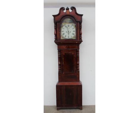 A 19th century mahogany longcase clock, the hood with a broken swan neck pediment and turned columns above a short trunk door