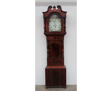 A 19th century mahogany longcase clock, the hood with a broken swan neck pediment and turned columns above a short trunk door