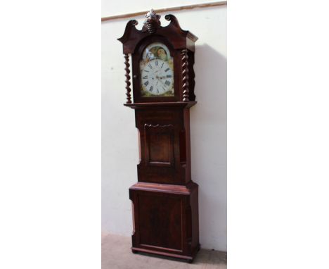 A 19th century mahogany longcase clock the hood with a central carved grapes and vine panel and rope twist column above a pan