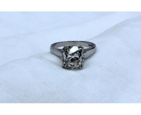 A solitaire diamond ring, the old cushion cut stone measuring 10mm x 9mm x 7mm deep, approximately 4.2 carats, claw set in a 