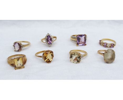 A 9ct yellow gold amethyst and topaz dress ring together with a citrine dress ring, and other assorted 9ct gold dress rings
 