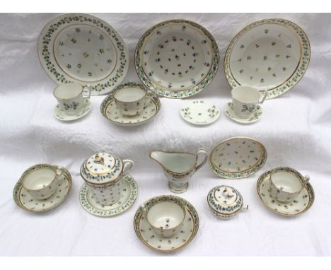 A group of porcelain tea wares including Derby, all similarly decorated with bands of cornflowers and gilt leaves, including 