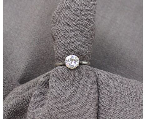 A solitaire diamond ring the brilliant cut diamond approximately 1.5 carats to a claw mount and white metal shank marked 18ct