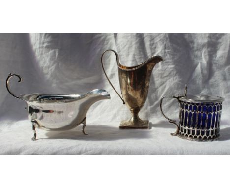 A Victorian silver mustard pot, with a pierced thumb piece, above a pierced body and blue glass liner, London, 1865, John Wil