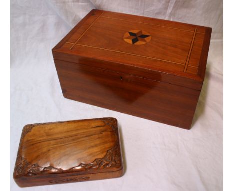 A 19th century mahogany box, of rectangular form inlaid with a star to the centre, enclosing a compartmented tray with button