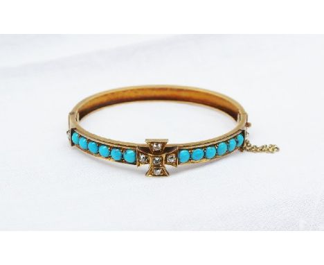 A Victorian yellow metal hinged bangle marked 15, with a central cross set with five old cut diamonds, flanked by two rows of