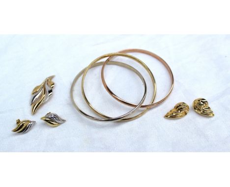 A pair of yellow metal earrings, of leaf shape marked 18k, approximately 3.6 grams together with a 9ct yellow gold brooch and