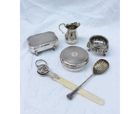 A Victorian silver open table salt, with a floral embossed body on lions paw feet, London, together with a silver cream jug, 