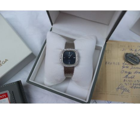 Omega - An 18ct white gold diamond set Omega De Ville lady's wristwatch, with a blue line decorated dial, batons on the quart