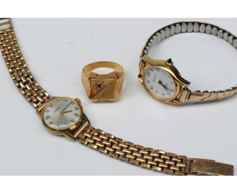 A yellow metal signet ring set with a red stone, marked 750, approximately 8.5 grams together with a Lady's Roamer wristwatch