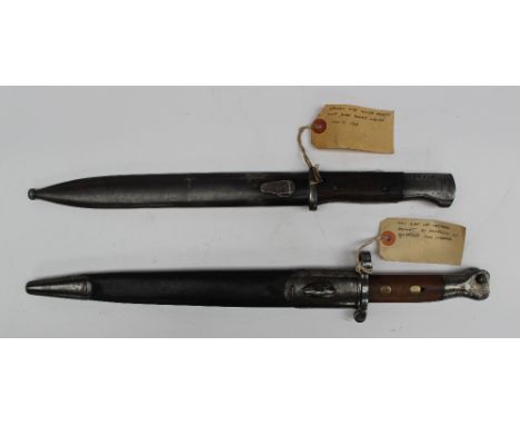 An 1888 pattern Mk1 Type 2 Lee Metford bayonet in its leather scabbard, together with A German Mauser K98 bayonet and scabbar